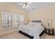 Cozy bedroom with a vaulted ceiling, three windows and neutral color scheme at 1208 Copper Creek Dr, Durham, NC 27713