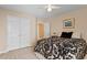 Comfortable bedroom with bed, ceiling fan and closet space at 1208 Copper Creek Dr, Durham, NC 27713