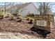 Stone sign identifying the Copper Creek community, complemented by lush landscaping at 1208 Copper Creek Dr, Durham, NC 27713