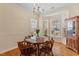 Bright dining room features hardwood floors, natural light and space for a full dining set at 1208 Copper Creek Dr, Durham, NC 27713