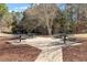 Outdoor picnic area with stone flooring and multiple picnic tables, great for community gatherings at 1208 Copper Creek Dr, Durham, NC 27713