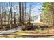 Scenic view of a wooden walking bridge surrounded by trees, enhancing the community's natural charm at 1208 Copper Creek Dr, Durham, NC 27713