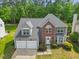 Beautiful aerial view of a home with a large backyard and mature trees, offering privacy and tranquility at 121 Talley Ridge Dr, Holly Springs, NC 27540