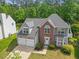 Beautiful aerial view of a home with a large backyard and mature trees, offering privacy and tranquility at 121 Talley Ridge Dr, Holly Springs, NC 27540