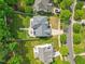 Overhead shot showing the layout of a house and its meticulously landscaped backyard with patio and seating area at 121 Talley Ridge Dr, Holly Springs, NC 27540
