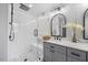 Bright bathroom featuring a glass-enclosed shower with subway tiles and marble counters at 121 Talley Ridge Dr, Holly Springs, NC 27540