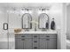 Elegant bathroom featuring double sinks, modern fixtures, and a separate glass-enclosed shower at 121 Talley Ridge Dr, Holly Springs, NC 27540