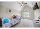 Cozy bedroom features carpet, vaulted ceiling, ceiling fan, and a window view at 121 Talley Ridge Dr, Holly Springs, NC 27540