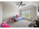 Bedroom features carpet, vaulted ceiling, ceiling fan, and a window view at 121 Talley Ridge Dr, Holly Springs, NC 27540