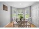 Bright dining area with a bay window offering natural light and a view of the outdoors at 121 Talley Ridge Dr, Holly Springs, NC 27540