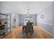 Formal dining room features hardwood floors, modern lighting, and space for entertaining at 121 Talley Ridge Dr, Holly Springs, NC 27540