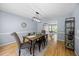 Formal dining room features a modern light fixture and is open to office space at 121 Talley Ridge Dr, Holly Springs, NC 27540