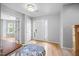 Inviting foyer with hardwood floors, natural light, and a view into a cozy living space at 121 Talley Ridge Dr, Holly Springs, NC 27540