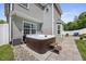 Backyard hot tub features stairs and hardscape; home exterior in background at 121 Talley Ridge Dr, Holly Springs, NC 27540