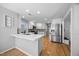 Spacious kitchen with stainless steel appliances, a breakfast bar, and ample counter space at 121 Talley Ridge Dr, Holly Springs, NC 27540