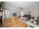 Spacious living room showcasing hardwood floors, a fireplace, and access to other living spaces at 121 Talley Ridge Dr, Holly Springs, NC 27540