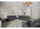 Relaxing living room showcases leather furniture, a ceiling fan, and neutral carpeting at 121 Talley Ridge Dr, Holly Springs, NC 27540