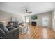 Bright living room featuring a fireplace, comfortable couches, and neutral decor at 121 Talley Ridge Dr, Holly Springs, NC 27540
