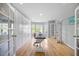 Well-lit office with hardwood floors, built-in storage, and french doors at 121 Talley Ridge Dr, Holly Springs, NC 27540