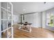Bright home office features hardwood floors, built-in storage, and modern desk and chair at 121 Talley Ridge Dr, Holly Springs, NC 27540