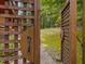 Wooden gate opens to a backyard and wooded area beyond at 123 Beech Forest Way, Pittsboro, NC 27312