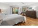 Serene bedroom with hardwood floors, natural light, and minimalist decor at 123 Beech Forest Way, Pittsboro, NC 27312