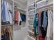 Organized walk-in closet with shelving, hanging racks, and storage options for clothes and accessories at 123 Beech Forest Way, Pittsboro, NC 27312
