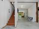Bright hallway with staircase and storage leading to outdoor lounge area at 123 Beech Forest Way, Pittsboro, NC 27312