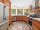Well-lit kitchen boasting stainless steel appliances and natural wood cabinetry at 123 Beech Forest Way, Pittsboro, NC 27312