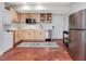 Modern kitchen with stainless steel appliances, bright cabinetry, and ample counter space for culinary creativity at 123 Beech Forest Way, Pittsboro, NC 27312