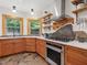 Beautiful kitchen featuring modern appliances, custom cabinets, and stone backsplash at 123 Beech Forest Way, Pittsboro, NC 27312