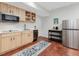 Stylish kitchen with stainless steel appliances and bright wood cabinets offers a functional and modern cooking space at 123 Beech Forest Way, Pittsboro, NC 27312