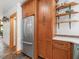 Kitchen featuring stainless steel refrigerator, wood cabinetry and modern countertop at 123 Beech Forest Way, Pittsboro, NC 27312
