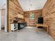 Cozy kitchenette with wooden walls, modern appliances, and ample counter space at 123 Beech Forest Way, Pittsboro, NC 27312