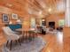 Cozy living room featuring vaulted wood ceilings, wood paneling, and comfortable seating at 123 Beech Forest Way, Pittsboro, NC 27312
