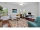 Cozy living room features a sofa, desk, and chair at 123 Beech Forest Way, Pittsboro, NC 27312