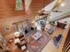 Aerial view showcasing the open-concept living area with vaulted ceilings, wood paneling, and natural light at 123 Beech Forest Way, Pittsboro, NC 27312