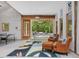 Open living room with a ping pong table and view of the pool and patio at 123 Beech Forest Way, Pittsboro, NC 27312