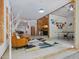 Open living space with seating, decor, ping pong table and backyard views at 123 Beech Forest Way, Pittsboro, NC 27312