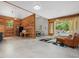 Open living space with kitchen, ping pong table, seating and backyard views at 123 Beech Forest Way, Pittsboro, NC 27312