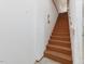 Classic wooden staircase with white walls, providing a timeless design element to the home's interior at 123 Beech Forest Way, Pittsboro, NC 27312