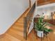 Staircase with wooden steps and black iron railing, leading to a second-floor landing at 123 Beech Forest Way, Pittsboro, NC 27312