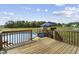 Wooden deck with outdoor seating near an above ground swimming pool and large grassy backyard at 123 Hawick Ct, Zebulon, NC 27597