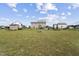 Large grassy backyard with firepit, swimming pool, shed, and privacy fence at 123 Hawick Ct, Zebulon, NC 27597