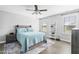 Charming bedroom featuring a ceiling fan, light grey walls, and a comfortable bed with an aqua quilt at 123 Hawick Ct, Zebulon, NC 27597