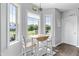 Bright breakfast nook featuring lots of windows, a table with seating, and views of the outdoors at 123 Hawick Ct, Zebulon, NC 27597