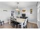 Comfortable dining room with a chandelier, farmhouse table, and elegant chairs, perfect for Gathering gatherings at 123 Hawick Ct, Zebulon, NC 27597