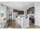 Open kitchen boasts granite countertops, a large island with seating, and stainless steel appliances at 123 Hawick Ct, Zebulon, NC 27597