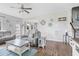 Spacious living room featuring comfortable seating, shiplap accent wall, and an open layout at 123 Hawick Ct, Zebulon, NC 27597