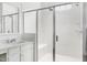 Modern bathroom featuring a tiled shower with glass door and bench seating at 1241 Keith Rd, Wake Forest, NC 27587